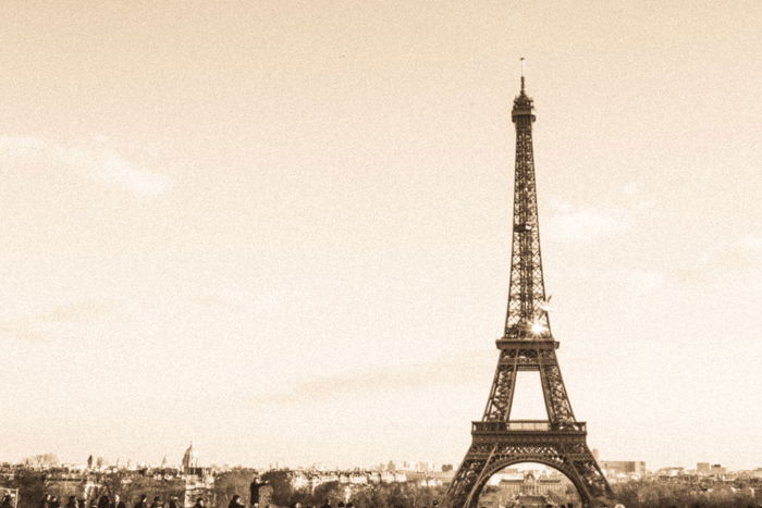 A sepia tone image of the Eiffel tower in Paris