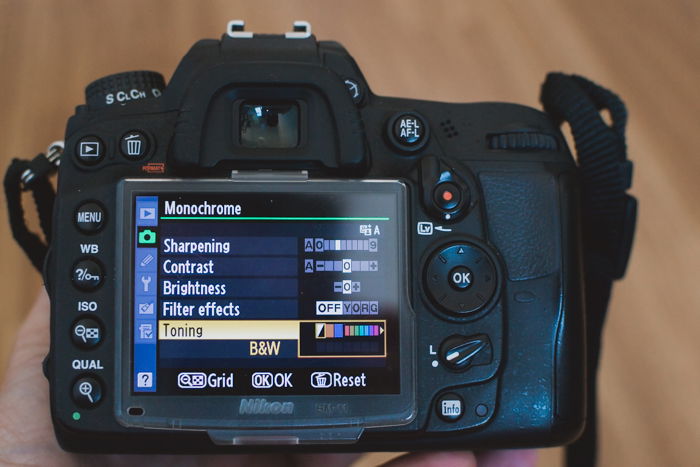 the settings on a Nikon DSLR showing how to shoot in sepia tone