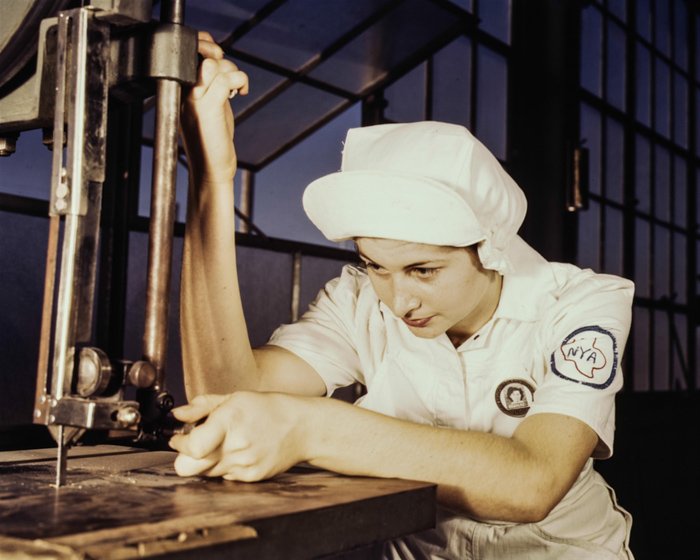 Color toned vintage photography of a female factory worker