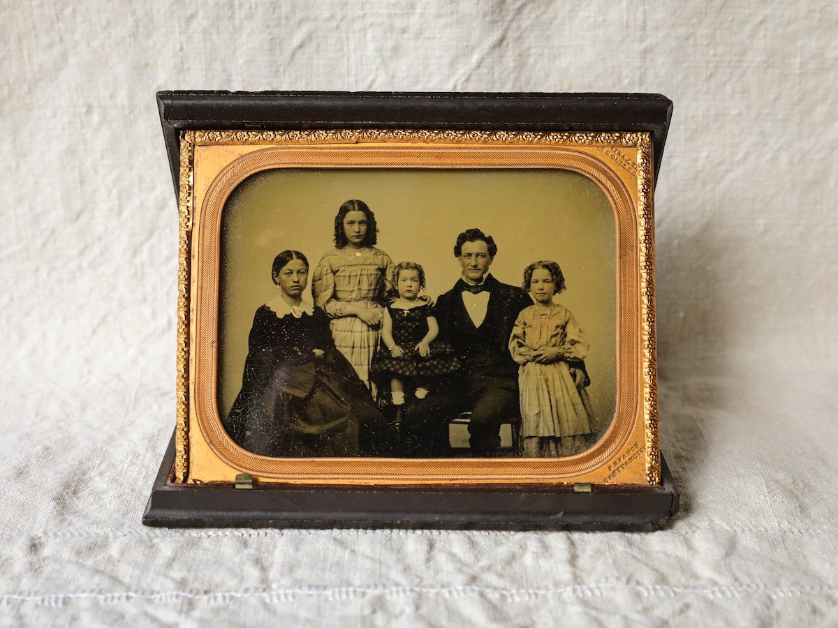 Photo of an original daguerrotype family portrait in a frame