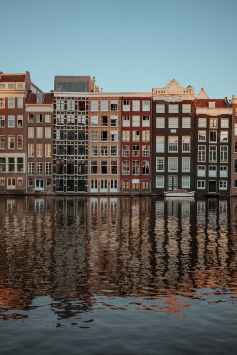View of buildings by the canal at Damrak