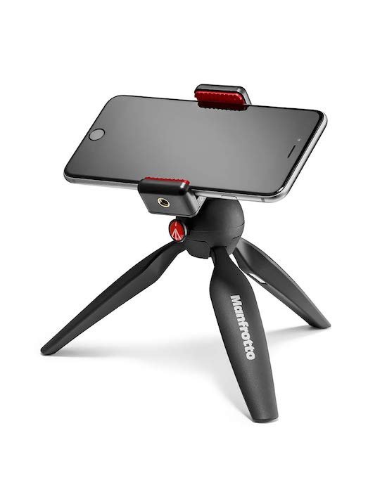 Manfrotto Table tripod with their universal phone clamp.