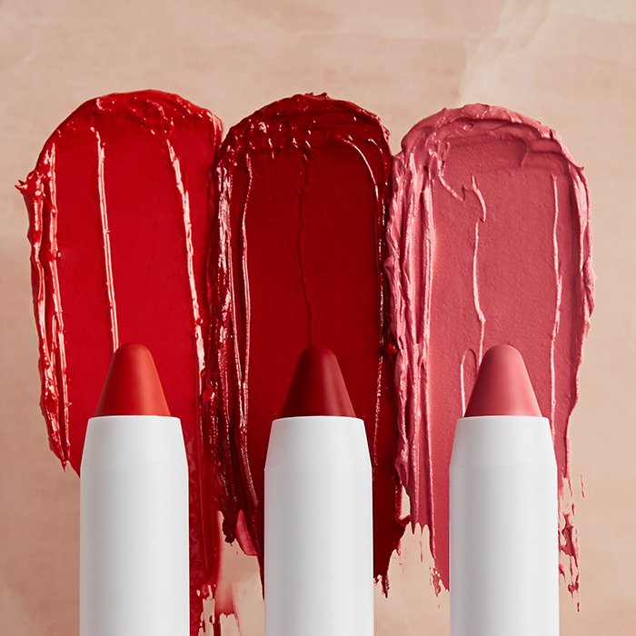 Product shot of three lipstick crayons in different shades - makeup photography tips 