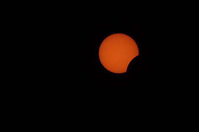  a partial solar eclipse where the Moon covers the Sun partially - solar photography