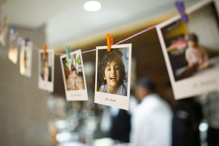 Portrait Polaroid photos hanging on a clothesline