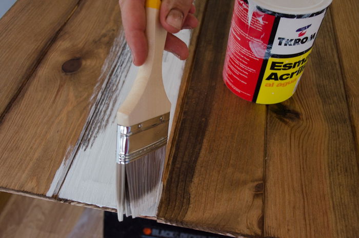 a person making a DIY wood backdrop for photography