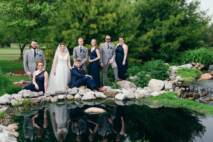 a group shot of the wedding party at an outdoor wedding photography shoot
