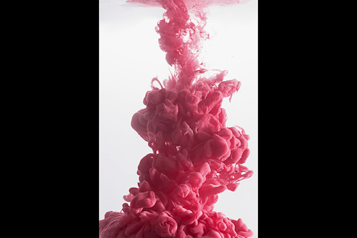 An abstract pink cloud using colorful paint in water photography technique