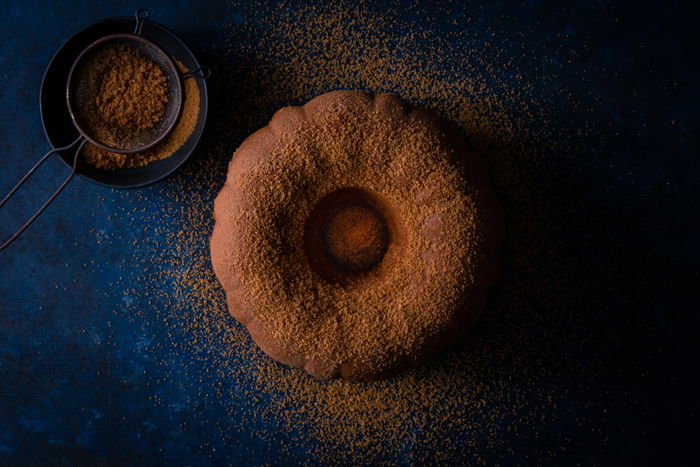 dark and moody shot of a chocolate cake shot with a prime lens