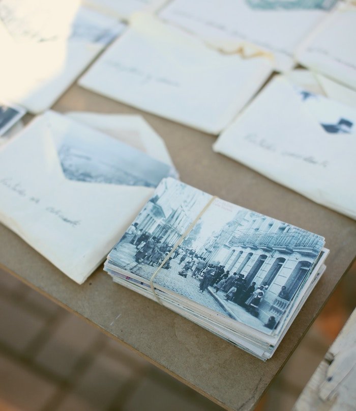 a table of printed vintage photographs