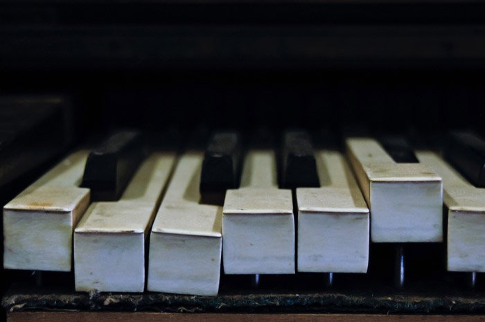 close up of piano keys - symbolism in photography