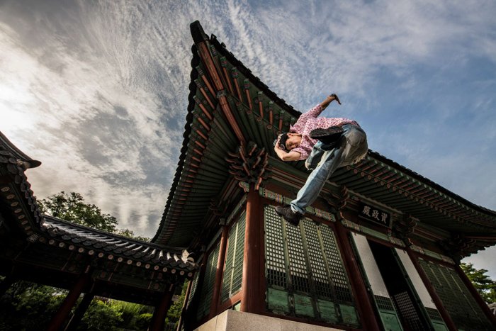 Stunning action portrait of a man doing a flying kick shot with the Profoto b10 flash