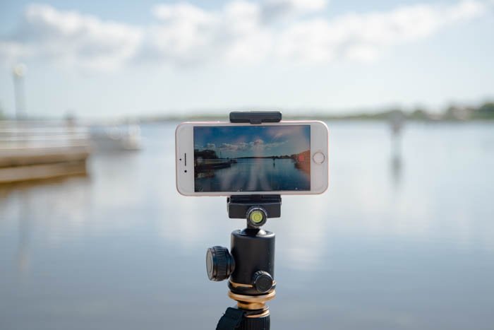 a phone on a tripod outdoors to shoot iphone time lapse photography