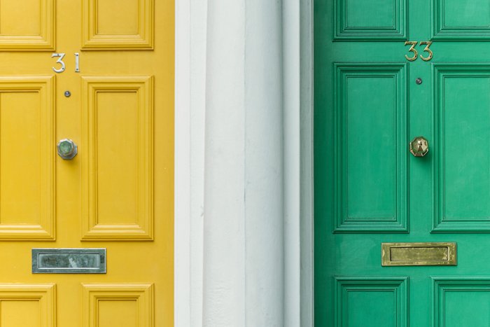 image of two doors; one yellow and one green