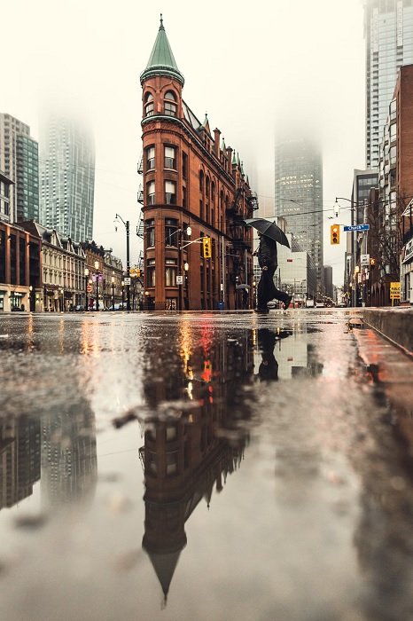 Low-angle shot of a wet city street