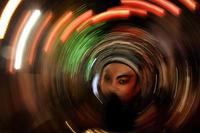 Artistic spiral blur of intentional camera movement around a persons face