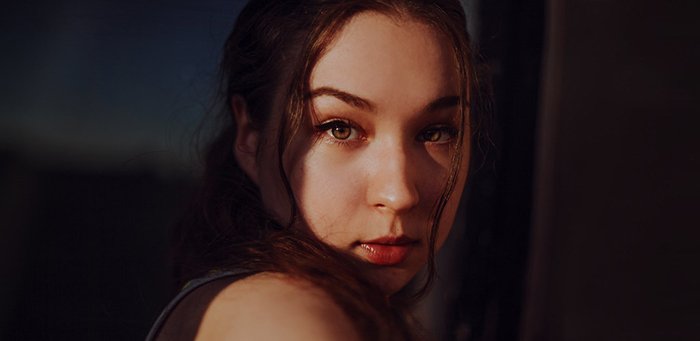 Close-up portrait of a girl in direct light