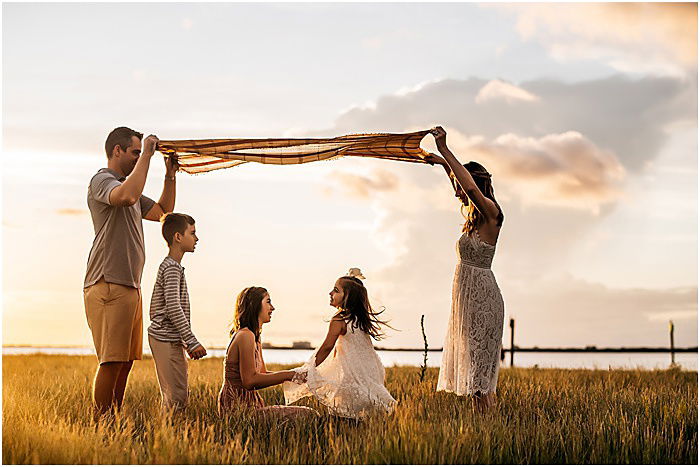 Photo of a family outdoors at sunset by Lennon Photography