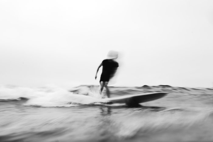 Motion blur photo of a man surfing