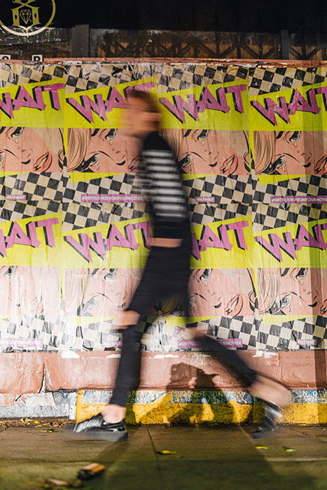 Motion blur photo of a man walking on the street