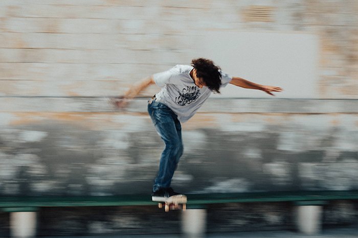 Motion blur photo of a man skateboarding