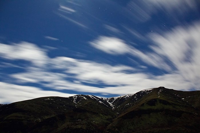 Motion blur photo of moving clouds in the sky