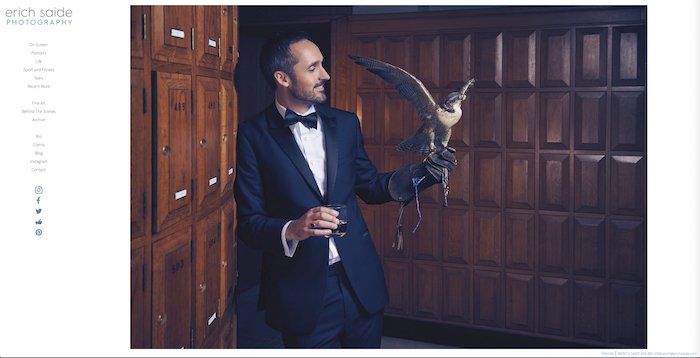 Photo of an elegantly dressed male model with a falcon in his hand by Erich Saide