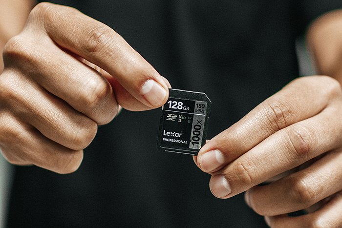 Photo of a man holding a memory card