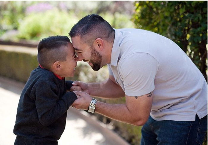 cute portrait of a father and little boy outdoors