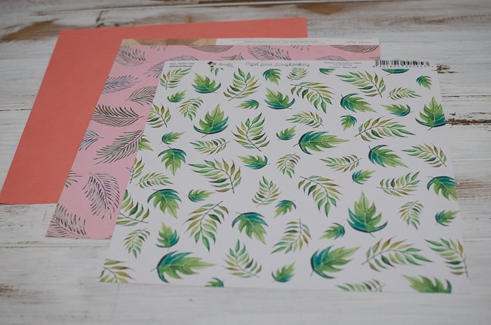 three sheets of different colorful papers for scrapbooking creations