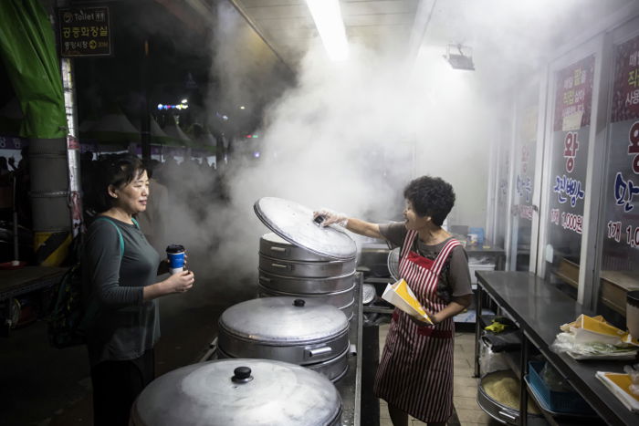 Photo of an Asian food market during nighttime