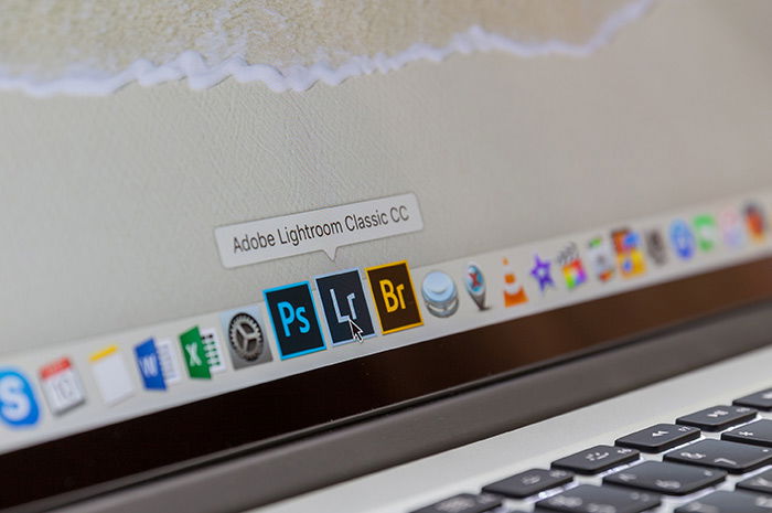 close up of Photoshop, Lightroom, Adobe Camera Raw icons on a laptop screen