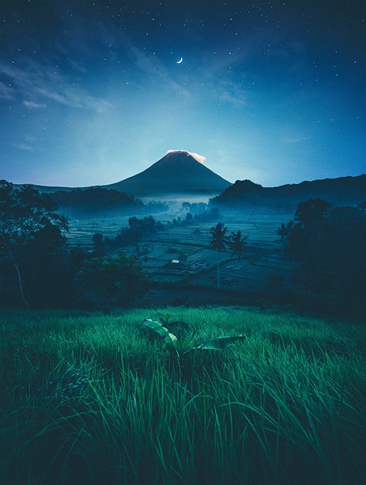 Photo of a landscape at night with softer blue tones