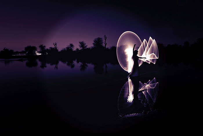 Photo of landscape with a human silhouette and light painting