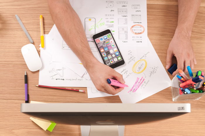 flat lay of a man working at an office desk