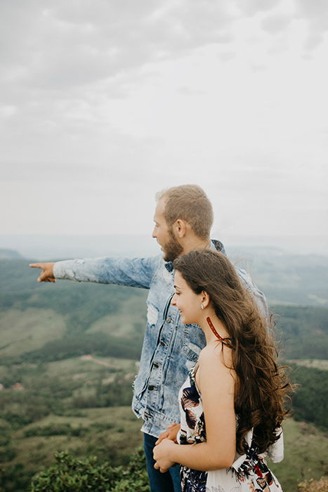 Portrait of a couple posing naturally on a hilltop