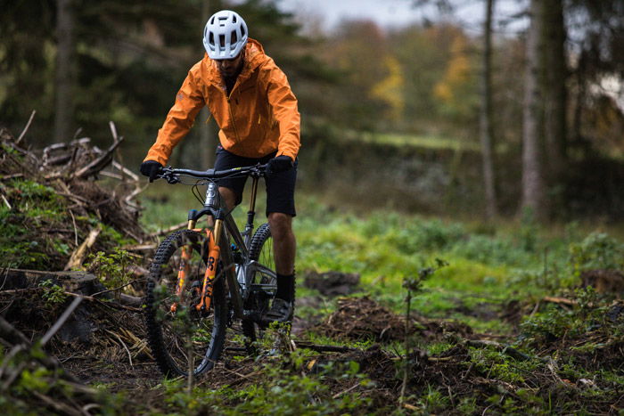 Photo of a man mountain biking