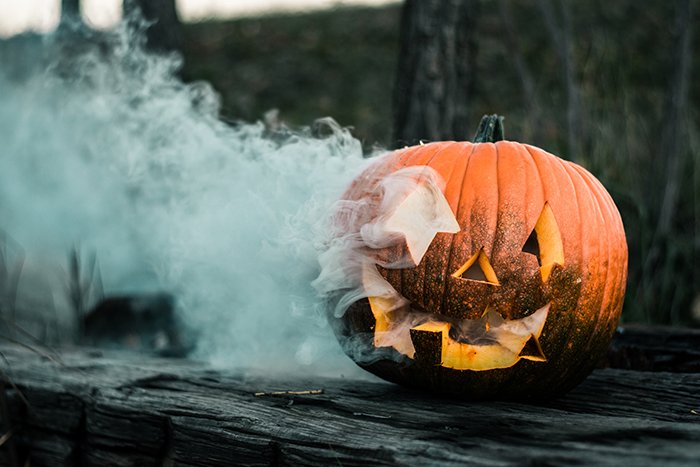 photo of a Halloween pumpkin with smoke coming out of it
