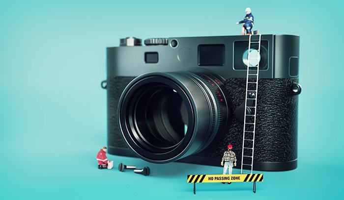 A camera with miniature figurines around it 
