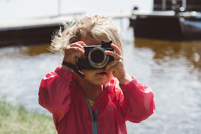 Photo of a little girl with a camera