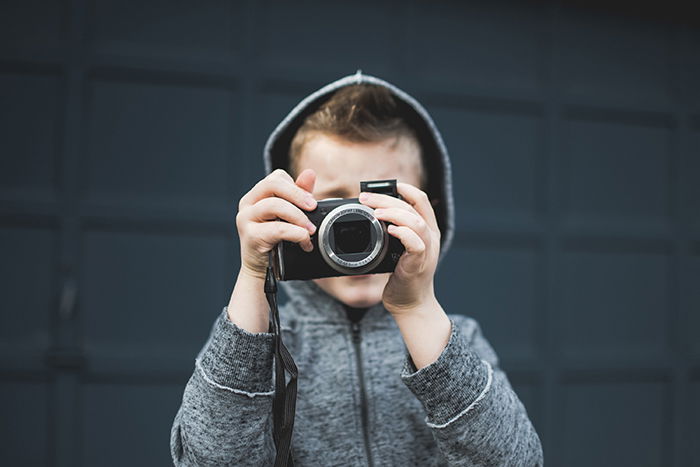 Photo of a little boy with a camera