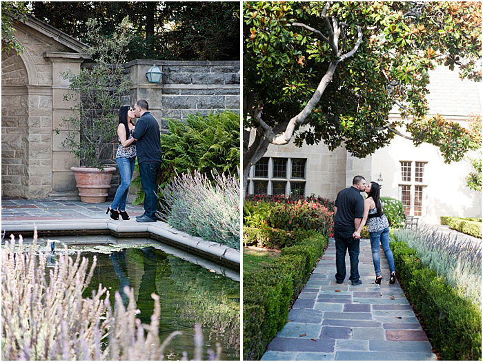 A couple holding hands and kissing in a garden 