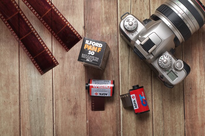 Film photography continues to be a photography trend: Photo of a film camera and film slides