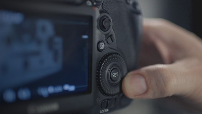 Close-up photo of changing the settings of a camera