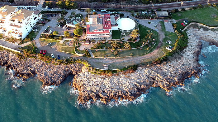 Drone photo of a building by the beach