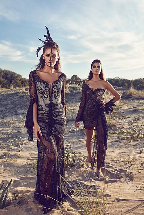 Photo of two models in black lace dresses outdoors