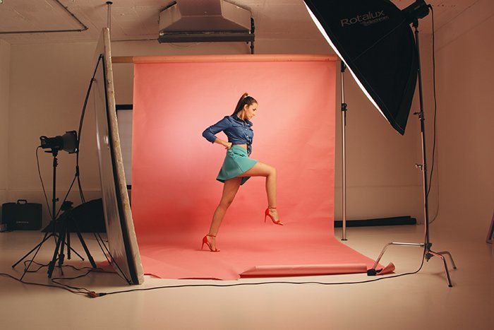 Photo of a model posing at a studio