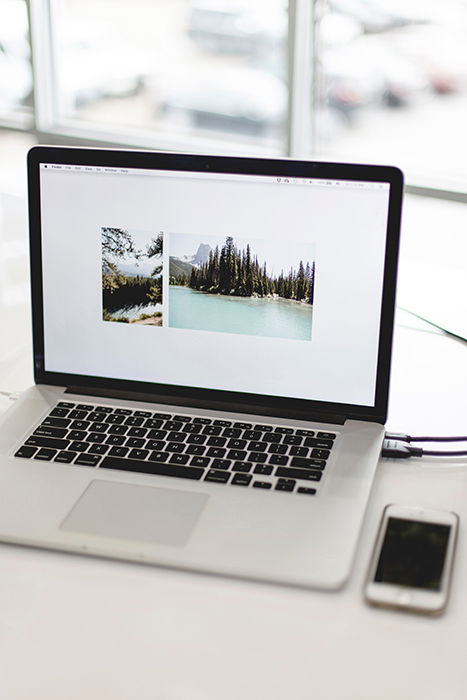 Photo of a laptop and a phone next to it