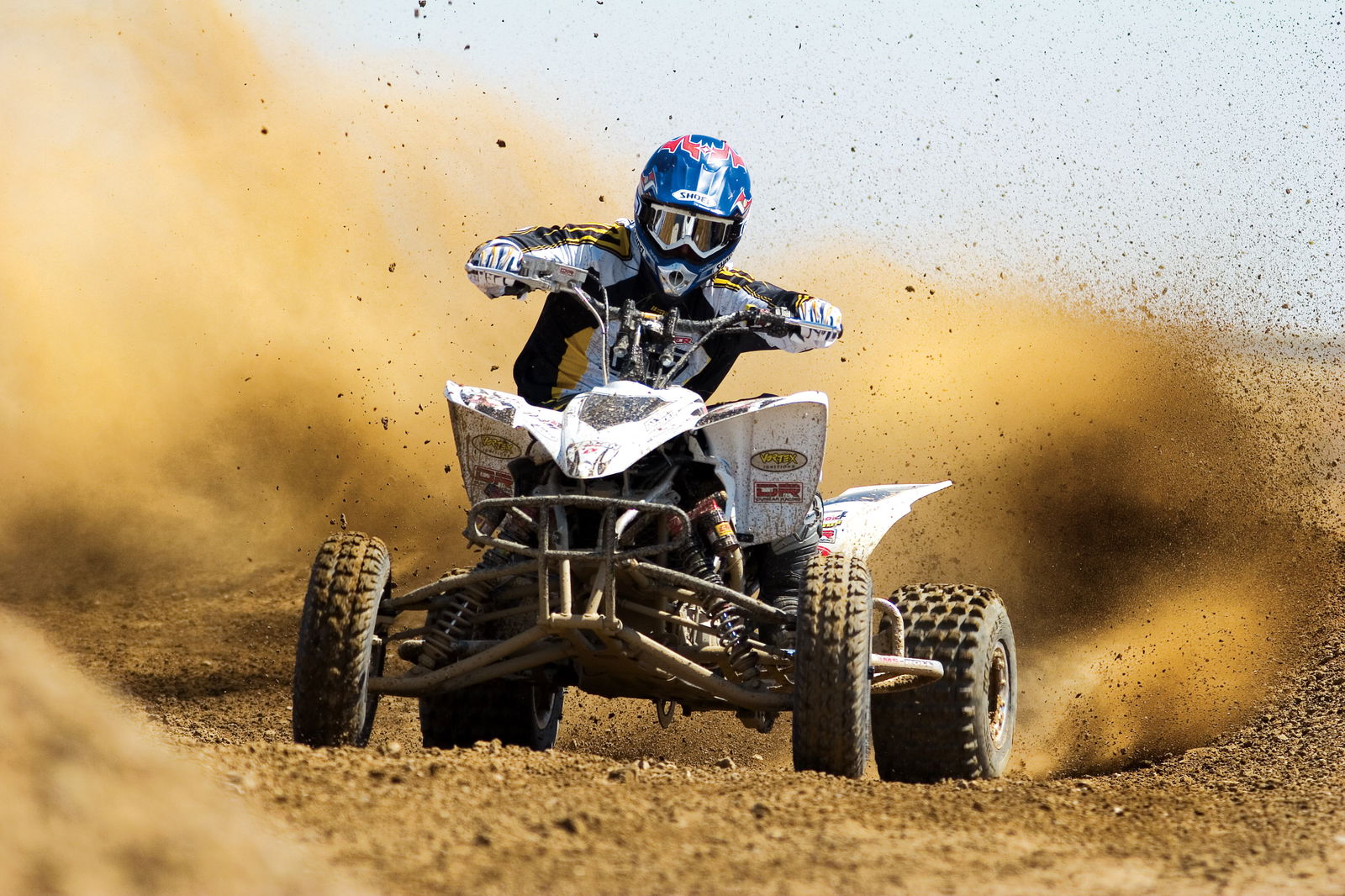 Photo of a quad racer in the sand