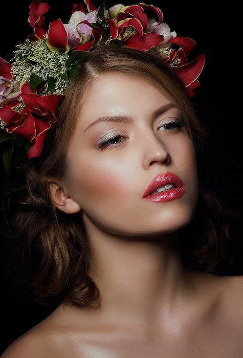 A retouched portrait image of a woman with flowers in her hair 